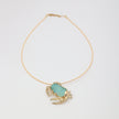 Crabby Necklace — handmade brass crab pendant necklace with large freeform resin stone on white background
