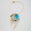 Kora Necklace — handmade brass crab pendant necklace with resin stone and crystal baguettes on white background
