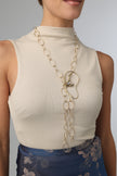  Handmade gold brass long oval chain necklace with sculptural pendant worn by model, Greek artisan statement jewelry.