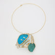 Necklace with blue and green pendant on a white background