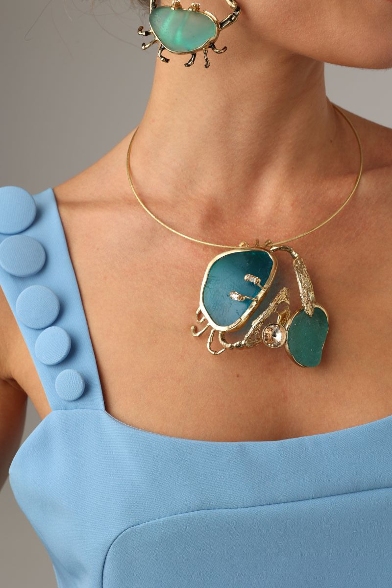 Crabby The Thief Necklace close-up — handmade brass artisan necklace with organic crab design and crystal detail