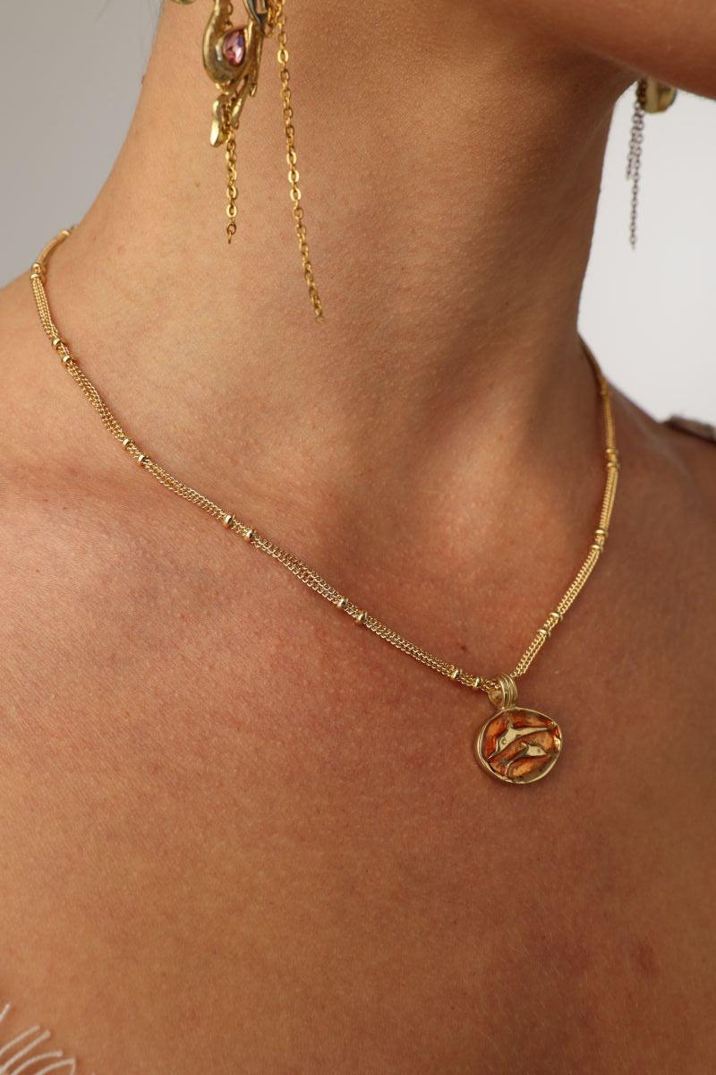 Delphi Necklace — handmade brass enamel coin pendant necklace with swallow motif, artisan jewelry made in Greece