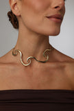 handmade brass sculptural wave choker necklace on model, front view