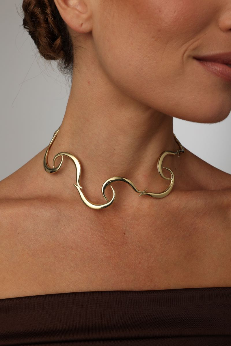  handmade brass wave choker necklace on model, side view