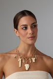 handmade brass statement charm necklace with Greek mythology pendants on model, full face