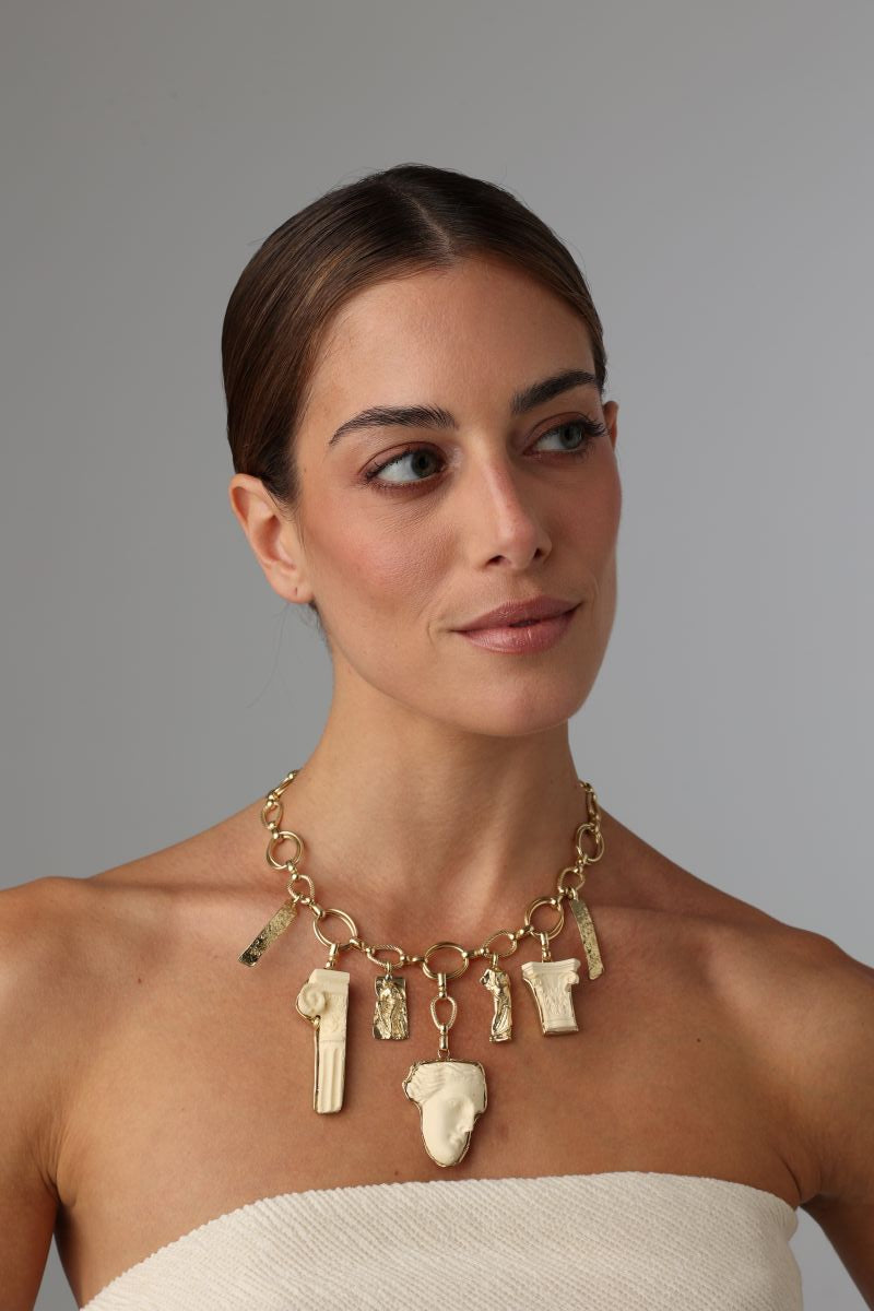 handmade brass statement charm necklace with Greek mythology pendants on model, full face