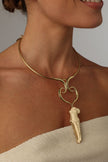 handmade brass torque necklace with Greek goddess pendant, close-up on model side view