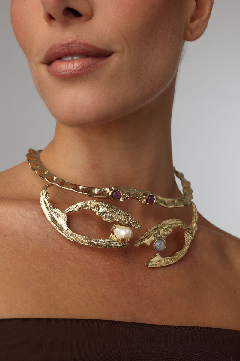 King Astor Necklace — handmade brass sculptural choker necklace with baroque pearl and moonstone on model, close-up