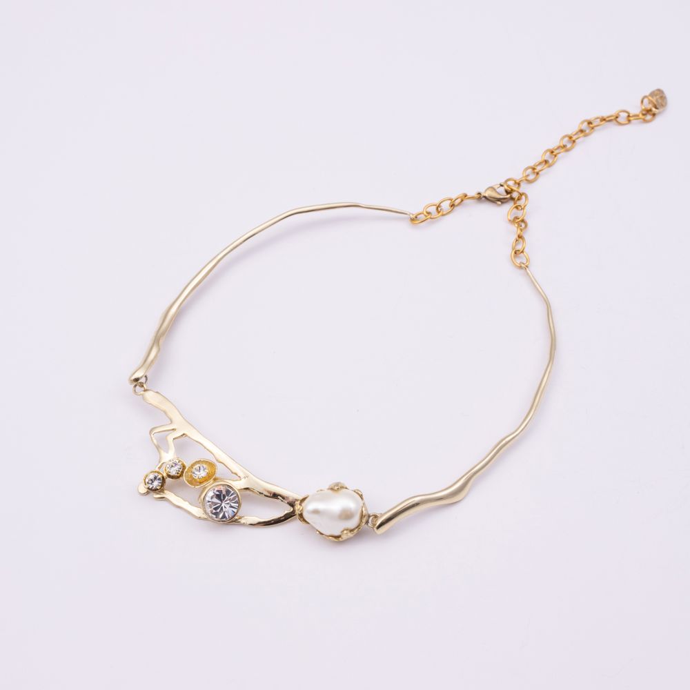 Brass branch-shaped choker necklace with pearl and crystal detail, product shot, Nerea