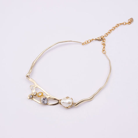 Brass branch-shaped choker necklace with pearl and crystal detail, product shot, Nerea