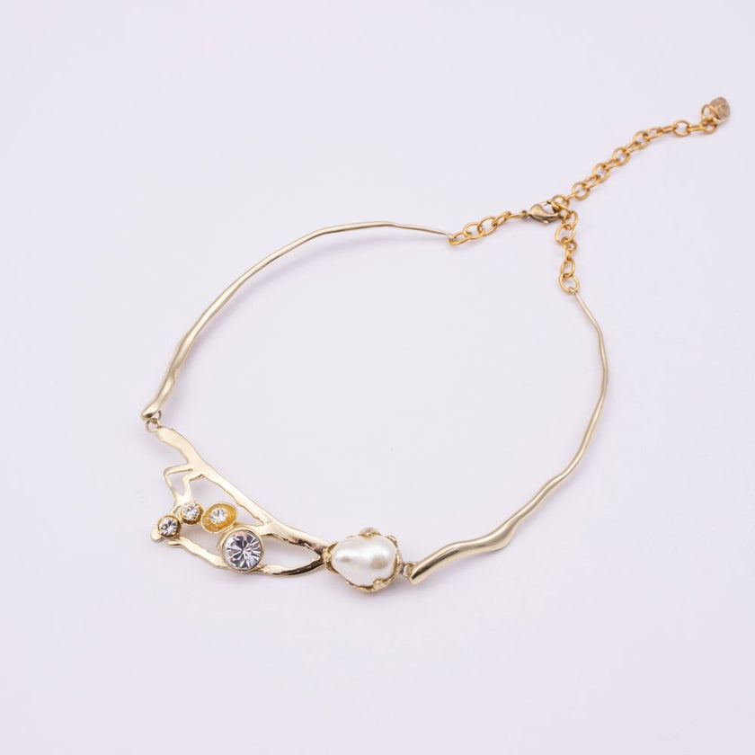 Brass branch-shaped choker necklace with pearl and crystal detail, product shot, Nerea