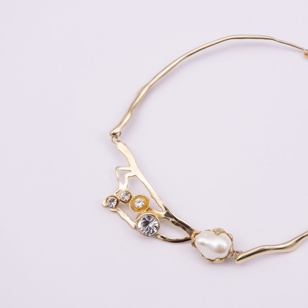 Brass choker necklace with pearl cluster and crystal branch design, close-up, Nerea