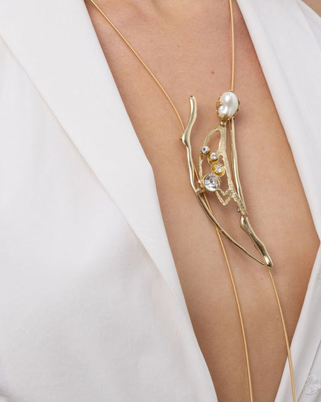 Handmade brass pearl and crystal branch pendant on long wire necklace, worn, Nerea Long