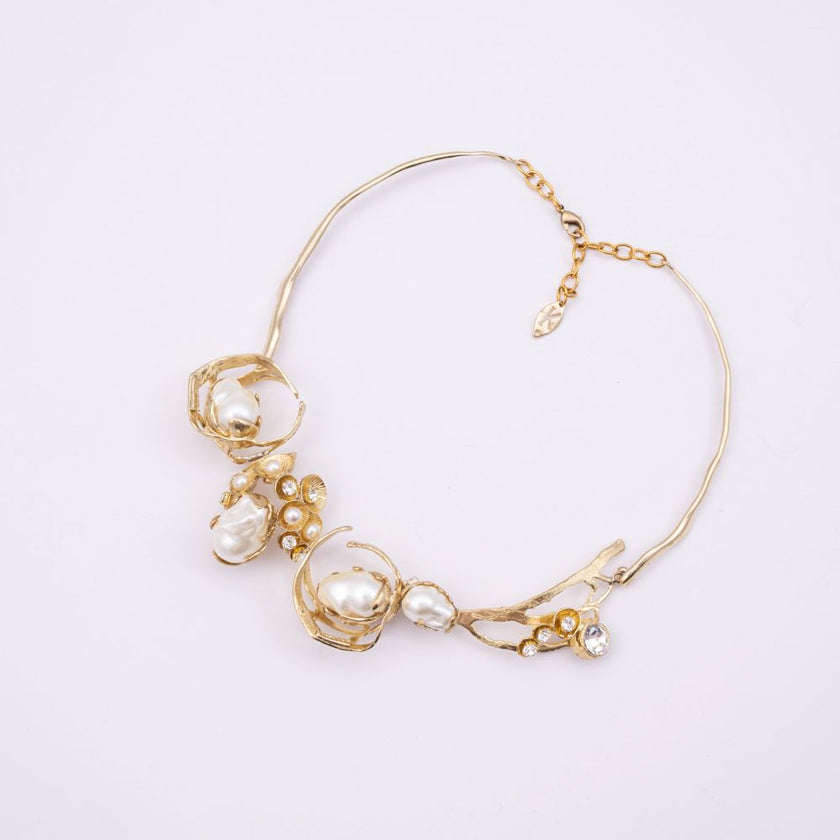 Brass necklace with pearl clusters and crystal branch detail, product shot