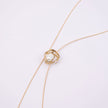Brass wire necklace with pearl nest pendant detail, close-up, Bubblegum