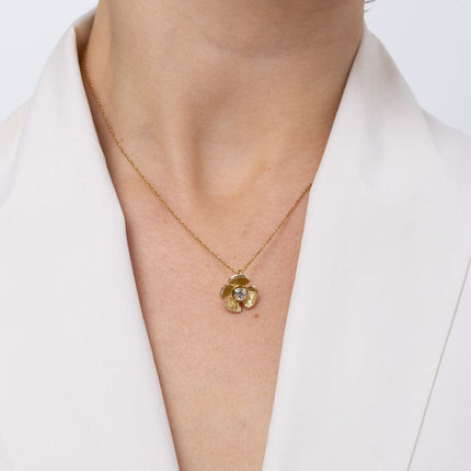 Brass flower pendant necklace with clear crystal center