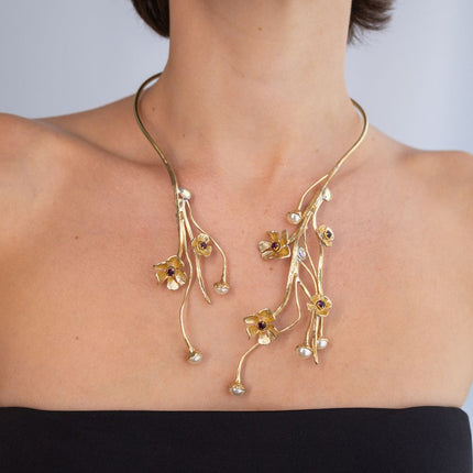 Handmade brass open collar necklace with trailing floral pearl stems, worn