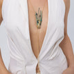 Woman wearing the Peacock long lariat necklace with green patina feathers and blue, purple and turquoise teardrop crystals, Savage Flora