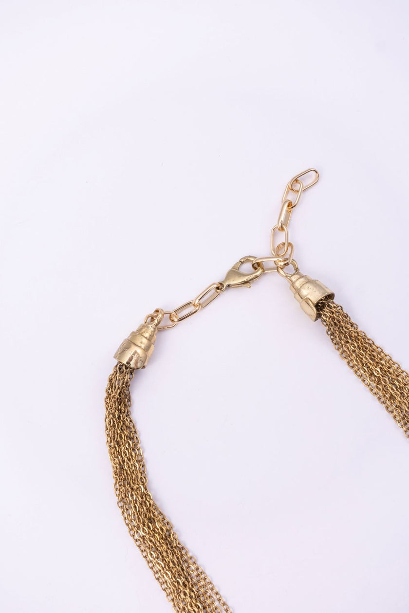 Double Peacock necklace clasp and adjustable gold chain detail on a white background