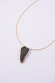 Edge Necklace front view: handmade brass geometric pendant necklace with faceted crystal surface