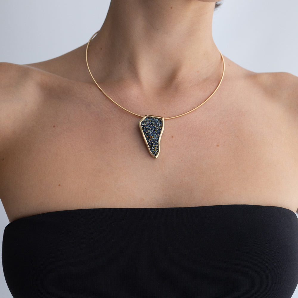 Edge Necklace on model: handmade brass pendant necklace worn at the neckline showing scale and proportion
