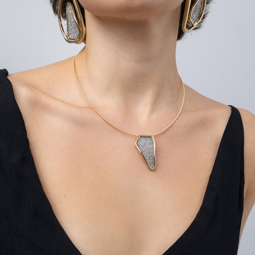 Edge Necklace on model: handmade brass geometric pendant necklace with sparkling crystals on a slim cord