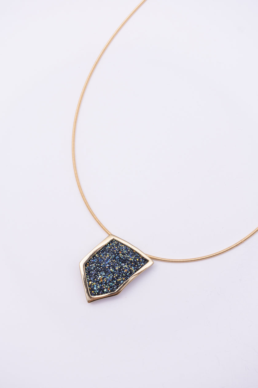 Sparkle Necklace front view: handmade brass geometric pendant necklace with faceted crystal surface