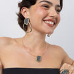 Sparkle Necklace on model, close up: handmade brass statement necklace with geometric crystal pendant