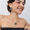 Sparkle Necklace on model, close up: handmade brass statement necklace with geometric crystal pendant