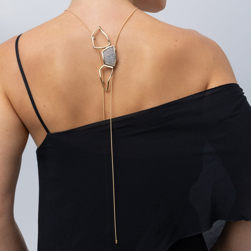 Glow Long Necklace on model, back look: handmade brass shiny long necklace with slim coiled cord