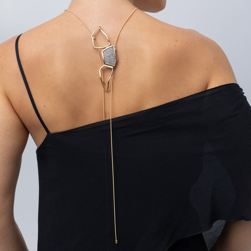 Glow Long Necklace on model, back look: handmade brass shiny long necklace with slim coiled cord