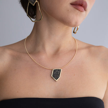 Sparkle Necklace on model: handmade brass pendant necklace worn at the neckline showing scale and proportion
