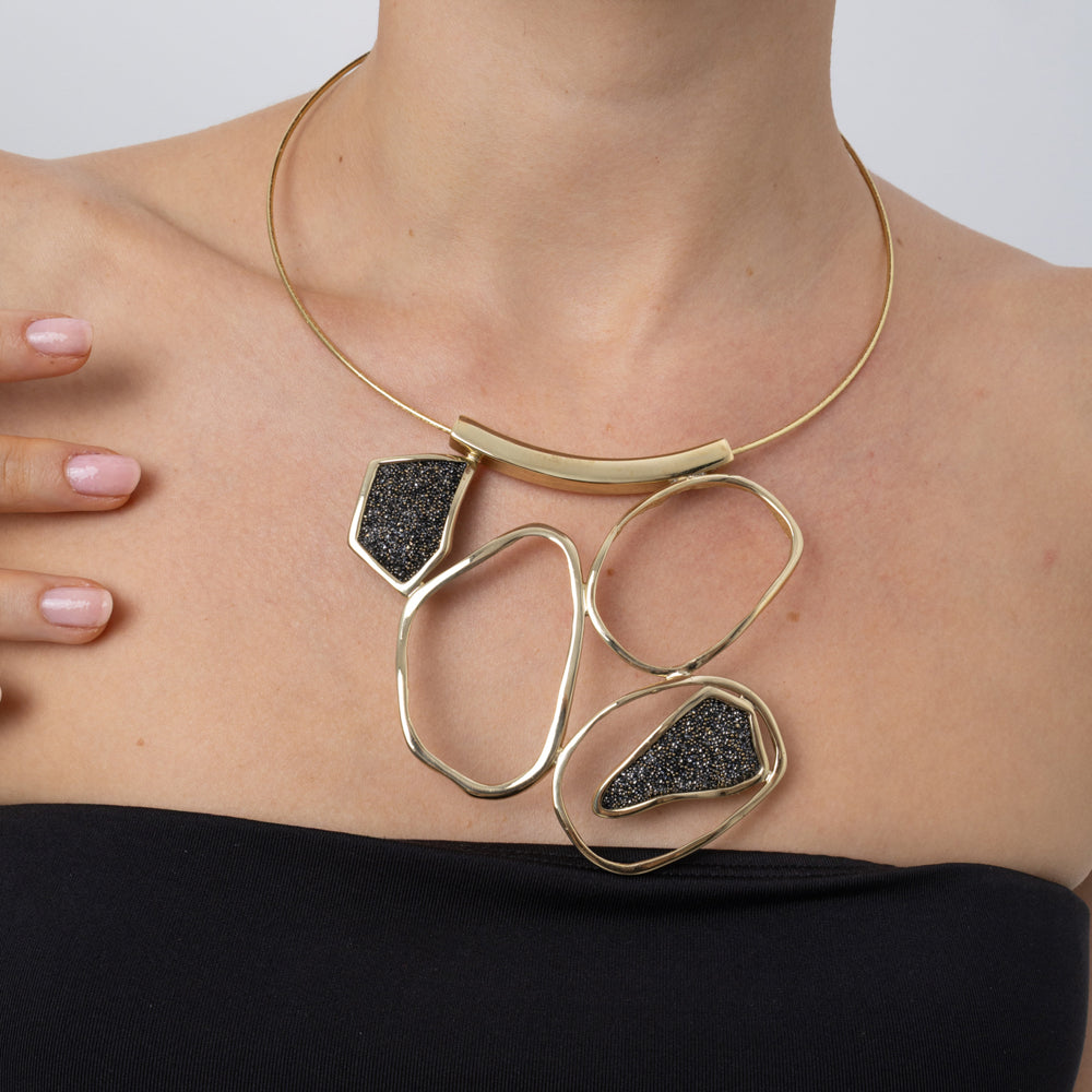 Glow Necklace on model: handmade brass sculptural collar necklace with sparkling crystals close up