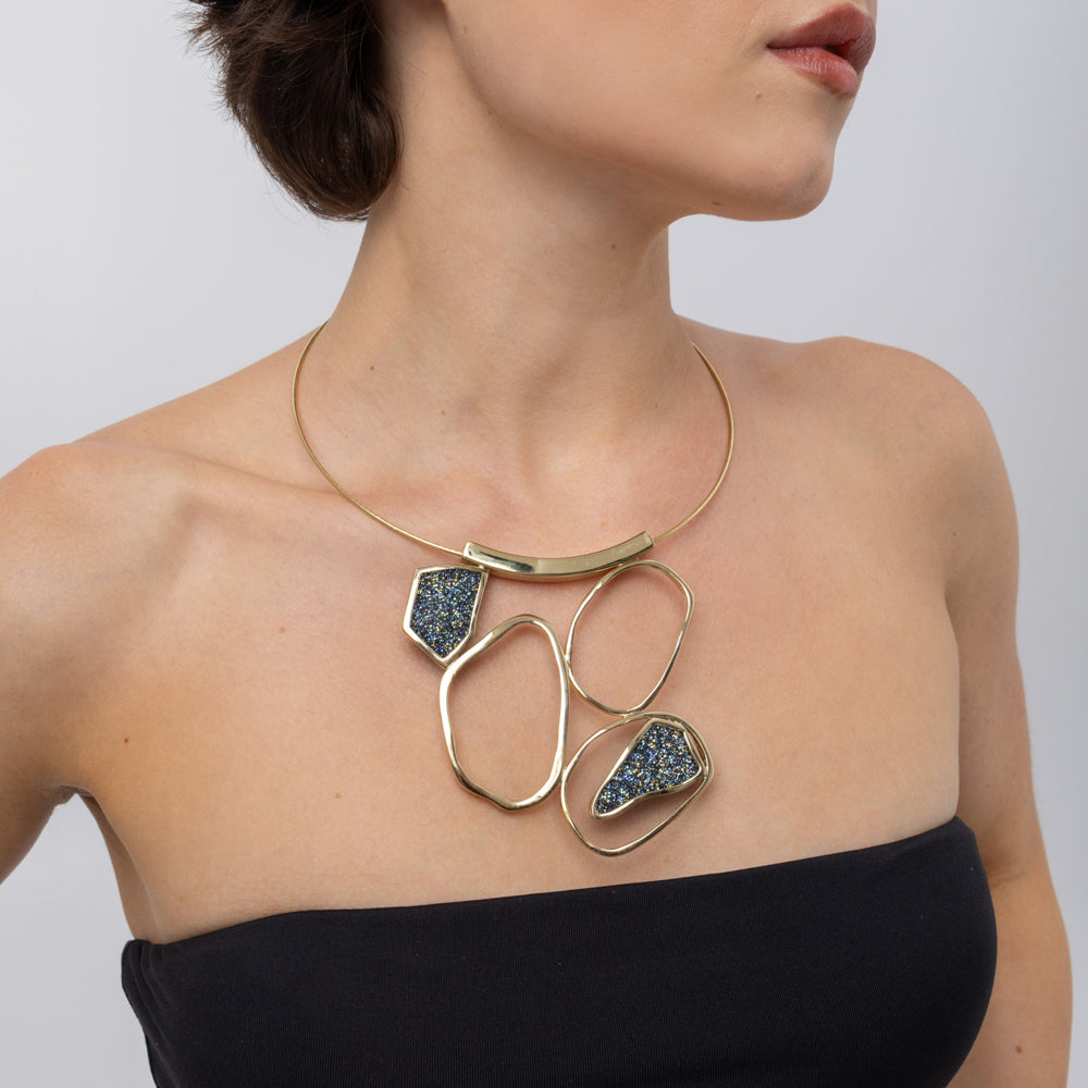 Glow Necklace on model: handmade brass collar necklace worn at the neckline showing scale and proportion
