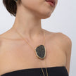 Shimmer Long Necklace on model: handmade brass sculptural long pendant necklace with sparkling crystals on slim coiled cords