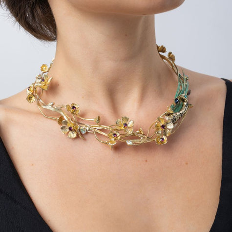 Side view of the Plume handmade gold branch and flower choker necklace with crystal centres and peacock detail, Savage Flora