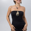 Model wearing the Kite black resin statement necklace with matching earrings and rings, Savage Flora