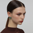 Stoneveil Earrings side view — handmade brass earrings with organic irregular silhouette