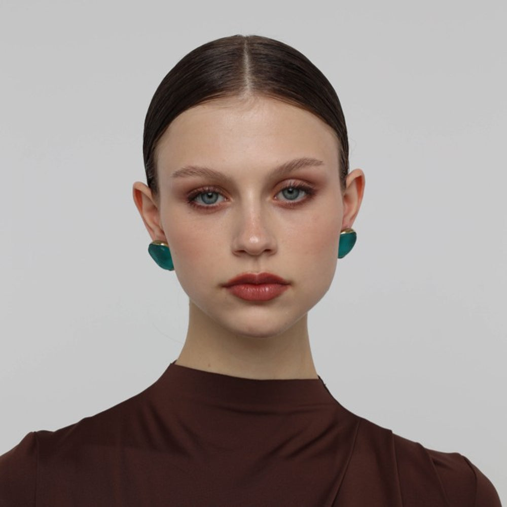 Stoneveil Earrings on model — handmade brass statement earrings worn on ear showing scale