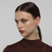 Earthpulse Earrings detail — handmade brass wire drop earrings with polished resin stone setting