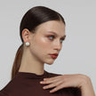 Kiss Button Earrings — handmade brass round stud earrings with resin stone on model