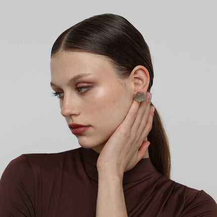 Kiss Button Earrings side view — handmade brass button earrings with organic circular silhouette