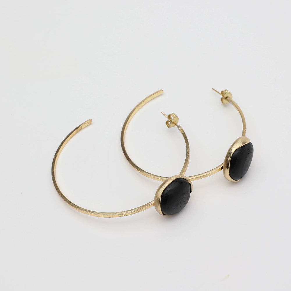 Kiss Hoop Earrings detail — handmade brass hoop with organic edge and resin stone setting