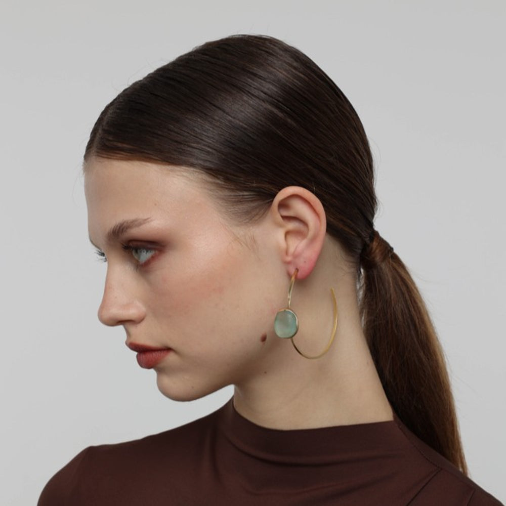 Kiss Hoop Earrings side view — handmade brass open hoop earrings with organic pebble shaped resin stone