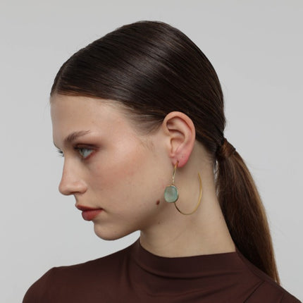 Kiss Hoop Earrings side view — handmade brass open hoop earrings with organic pebble shaped resin stone