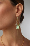  Shelly Earring — handmade brass charm hoop earrings with enamel spiral shell and crystal drops on model, close-up
