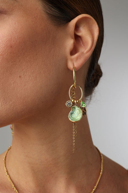  Shelly Earring — handmade brass charm hoop earrings with enamel spiral shell and crystal drops on model, close-up