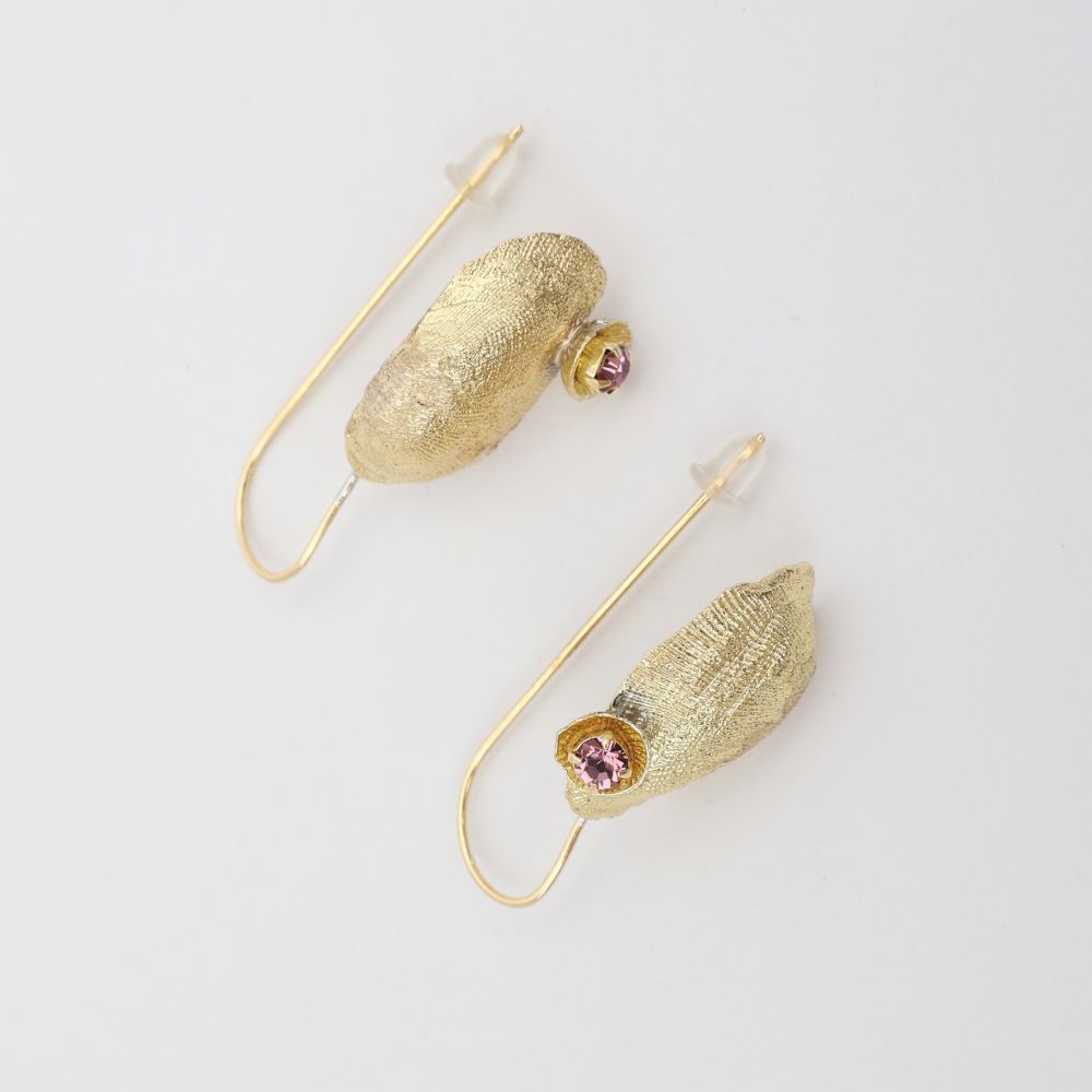 Limpet Earring — handmade brass shell pin wire drop earrings with pink crystal, flat lay