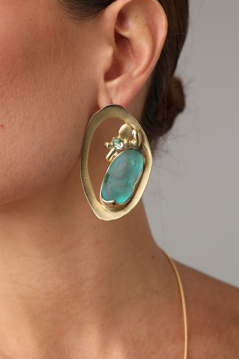  Pulse Earring — handmade brass large oval frame stud earrings with raw sea glass stone on model, statement artisan jewelry