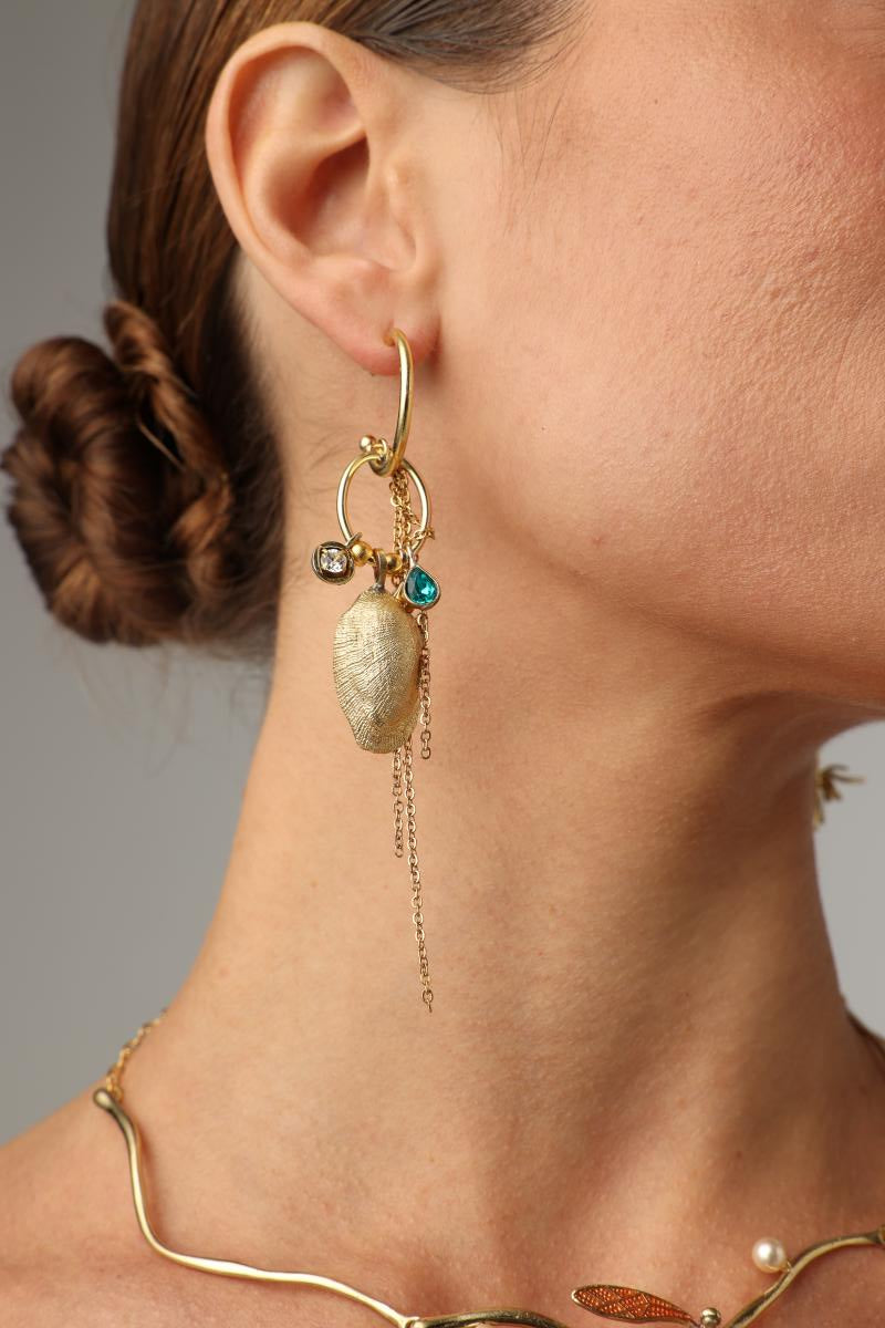 Charmy Limpet Earring — handmade brass charm hoop earrings with limpet shell and crystal drops on model